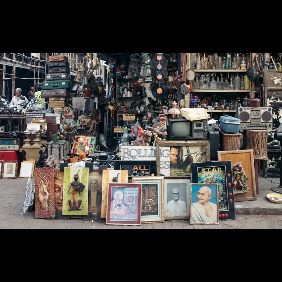 Handicraft items i and paintings placed in a shop at Chor Bazaar Mumbai. This is a beauty of India shown in image as a Hidden markets in India